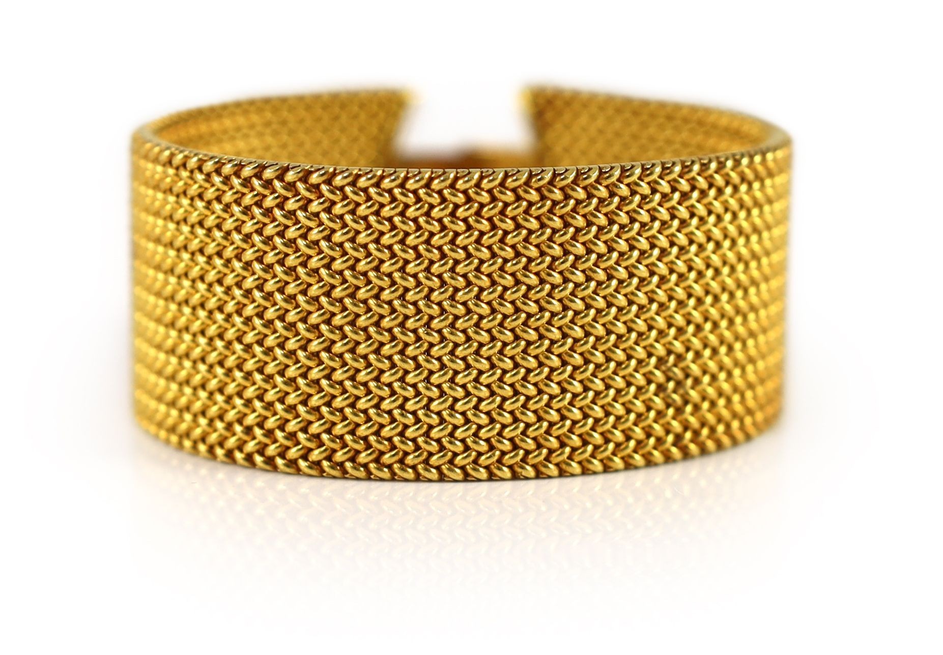 A Victorian gold mesh link bracelet section, lacking central motif
